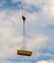 Load boards supplied to the construction site with a crane Royalty Free Stock Photo