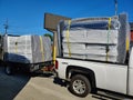 Load of mattresses on a truck and trailer