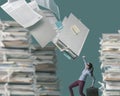 Load of paperwork falling over a businesswoman