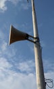 Load speaker. Vintage horn speaker for public relations on blue sky background Royalty Free Stock Photo