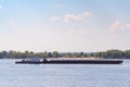 A loaded barge sails along the Volga River