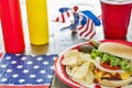 Loaded cheeseburger at a patriotic themed cookout Royalty Free Stock Photo