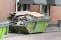 Loaded dumpster near construction site Royalty Free Stock Photo