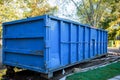 roll-off dumpster filled with building rubble