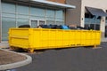 Loaded dumpster near a construction site, home renovation Royalty Free Stock Photo