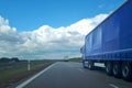 Loaded European truck transporting cargo. Truck on asphalt road. Logistic and transport