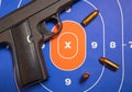 Firearm and Bullets on Practice Gun Target Royalty Free Stock Photo