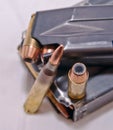 A loaded handgun magazine with 40 caliber bullets and a loaded rifle magazine with .223 caliber bullets