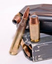 A loaded handgun magazine with 40 caliber bullets and a loaded rifle magazine with .223 caliber bullets