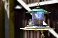 A loaded hanging bird feeder Royalty Free Stock Photo