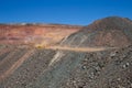 A loaded haulpak driving from the bottom of the Kalgoorlie Super Pit, one of the largest gold mines in the World. Gold was Royalty Free Stock Photo