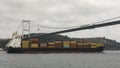 Loaded maritime tanker floats under the bridge through the Golden Horn in Istanbul, Turkey.