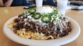 Loaded nachos, cafe setting, lunch,  meat, cheese, jalape?os Royalty Free Stock Photo