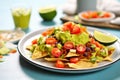 loaded nachos with guacamole and ground beef topping Royalty Free Stock Photo