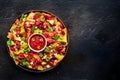 Loaded nachos. Mexican nacho chips with beef, overhead flat lay shot Royalty Free Stock Photo