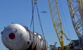 Loaded onto huge multi wheeled heavy haulage trucks are these huge refinery storage vessels.