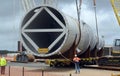 Loaded onto huge multi wheeled heavy haulage trucks are these huge refinery storage vessels.