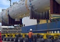 Loaded onto huge multi wheeled heavy haulage trucks are these huge refinery storage vessels.