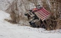 Loaded truck overturned on a slippery winter road