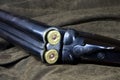 Vintage Shotgun with Cartridges on an Outdoor Coat Royalty Free Stock Photo