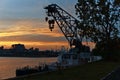 A loader on a boat Montreal with a background of a skyline of river and a city at the time between sunset and twilight. Royalty Free Stock Photo