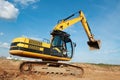 Loader excavator moving in a quarry Royalty Free Stock Photo