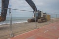 Loader excavator tractor, beach road construction Royalty Free Stock Photo