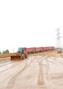 a loader operator is cleaning a muddy road at a mining site