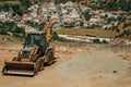 Loader and pile of gravel on a construction site