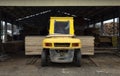 The loader transports round logs at the sawmill Royalty Free Stock Photo