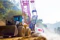 Loader truck and mobile crane is coming up hill Royalty Free Stock Photo