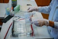 Loading the agarose gel with samples for the separation of DNA fragments for electrophoresis. Device for gel-electrophoresis Royalty Free Stock Photo