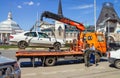 Loading of automobile car on wrecker for parking infringement in Royalty Free Stock Photo