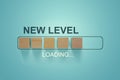 Loading bar progress concept. Next Level text loading almost complete with wooden blocks in progress bar Royalty Free Stock Photo