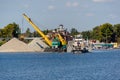 Loading barge with sand and rubble on a small berth. Freight transport logistics. Russia, Moscow region, August 2108