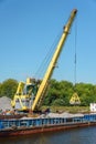 Loading barge with sand and rubble on a small berth. Freight transport logistics. Russia, Moscow region, August 2108