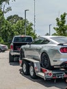 Loading broken car on a tow truck on a roadside Royalty Free Stock Photo