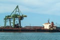 Loading of bulk goods in a harbor Royalty Free Stock Photo