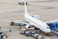 Loading cargo into the aircraft before departure Royalty Free Stock Photo