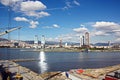 Loading cargo of cement clinker in bulk carrier by ships cranes in the port of Izmir, Turkey. Royalty Free Stock Photo