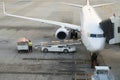 Loading cargo on the plane in airport. Cargo airplane loading or