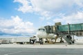 Loading cargo on plane in airport. cargo plane loading for logistic and transport. view through window Passenger terminal Royalty Free Stock Photo