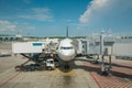 Loading cargo on plane in airport before flight. Foreman control loading Containers box to cargo plane Royalty Free Stock Photo