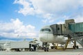 Loading cargo on plane in airport. cargo plane loading for logistic and transport. view through window Passenger terminal Royalty Free Stock Photo