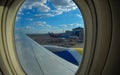 Loading cargo on plane in airport. cargo plane loading for logistic and transport. view through window Royalty Free Stock Photo