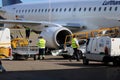 Loading cargo on plane Royalty Free Stock Photo