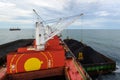 Loading coal on bulk vessel ship in offshore cargo port