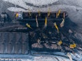 Loading coal mining in port on cargo tanker ship with crane bucket of train. Aerial top view Royalty Free Stock Photo