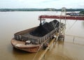 Loading coal onto the barge from the stock pile, aerial view