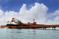 Loading coal from stockpile to vessel Royalty Free Stock Photo